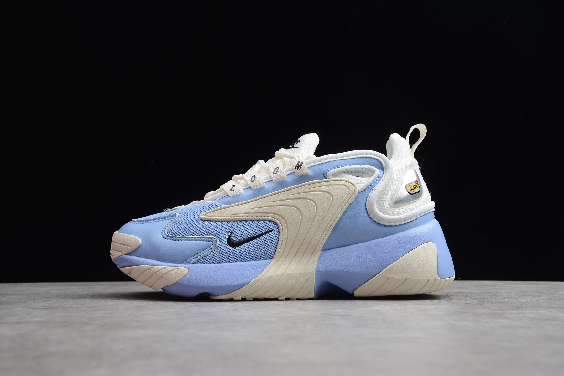 blue and white nike zoom 2k